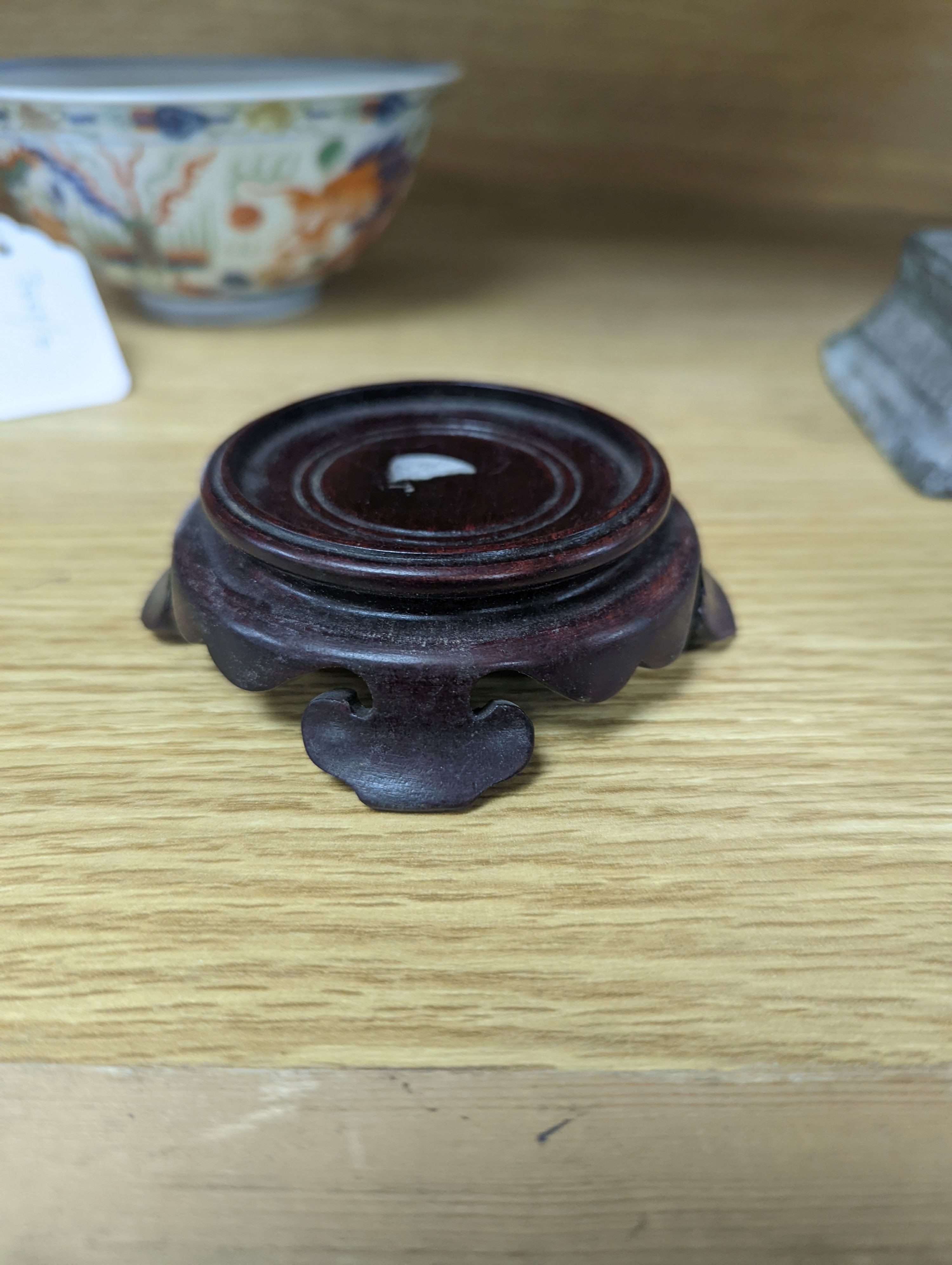 A Wucai bowl, dragon and flamingo pearl decoration, Jiaqing mark, on wood stand. 16cm diameter